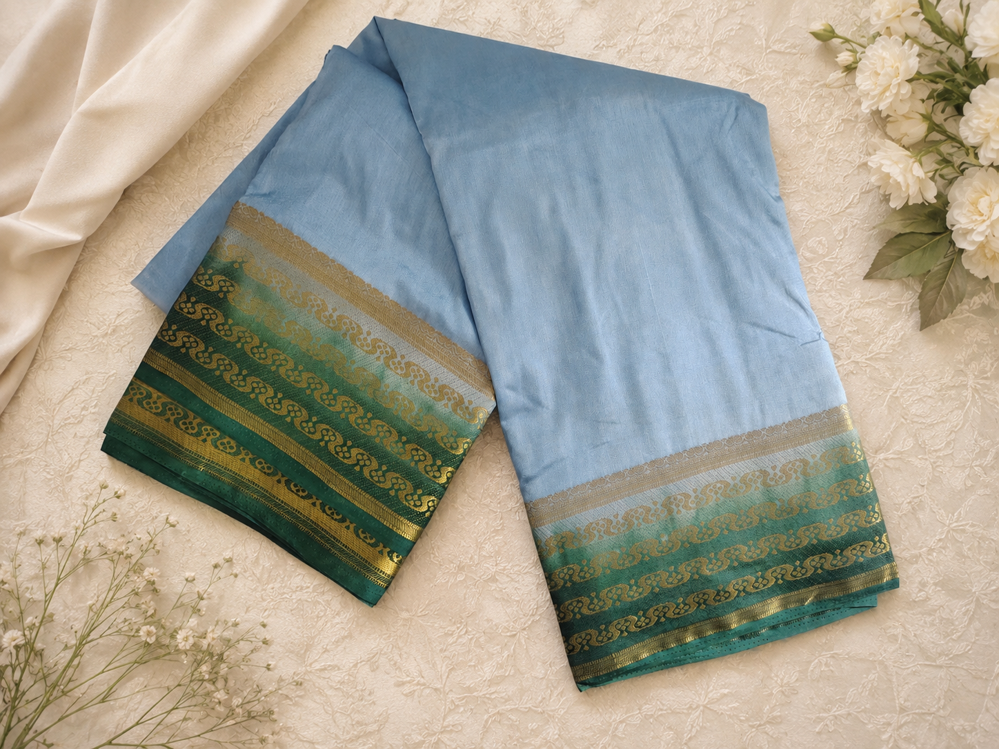 Powder blue and green saree