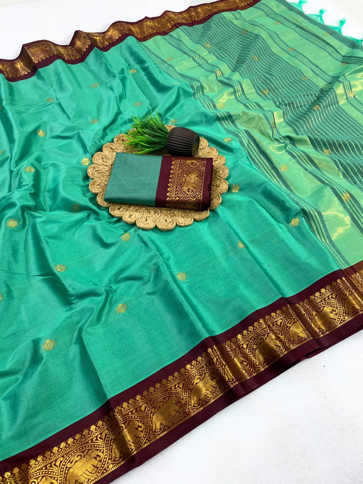 mint green and burgundy saree